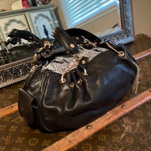 Used in mint condition black soft leather juicy couture.